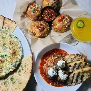 Spicy garlic knots, meatballs and artichoke dip