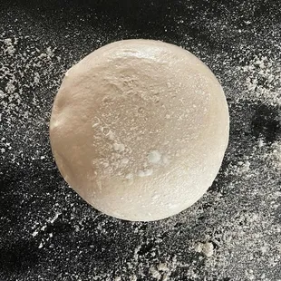 a ball of dough on a floured surface