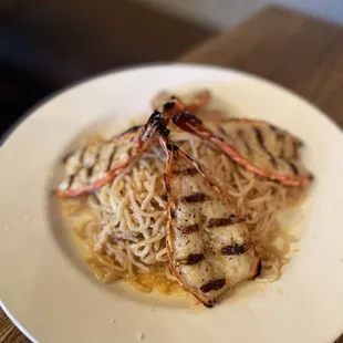 a plate of pasta and shrimp