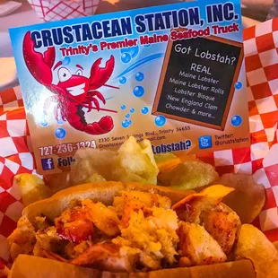 Warm lobster roll with butter and served with cape cod potato chips