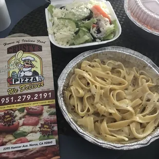 Fettuccine, side salad and a side of meat sauce.