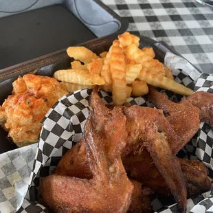 Wings, fries, and potato salad.