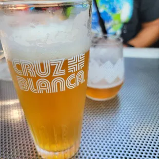 a glass of beer on a table
