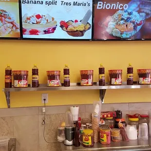 a counter with a variety of food items