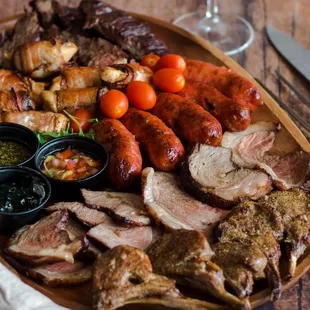 a platter of meat and vegetables