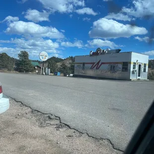 a gas station and a stop sign