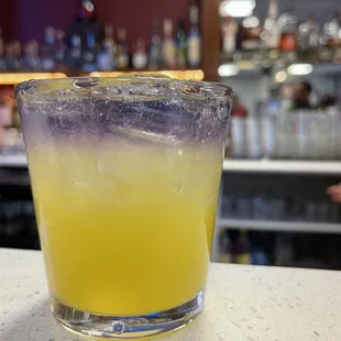 Abrazo Apasionado - Gin and Passionfruit cocktail with floater of Empress 1908 (Indigo) gin