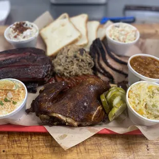 Mutton Buster Platter - Feeds 3-4 people. 1/2 LB of Sliced Brisket, Pulled Pork, Half Rack of Ribs, BBQ Half Chicken, Sausage and sides