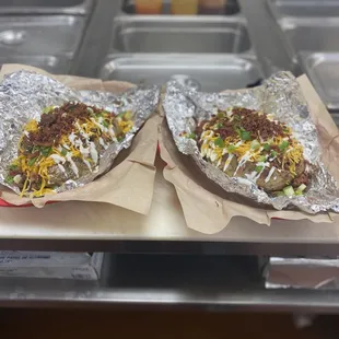 Loaded Baked Potatoes with your choice of meat - Brisket, Pulled Pork, Pulled Chicken or Sausage