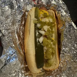  hot dog with pickles and onions