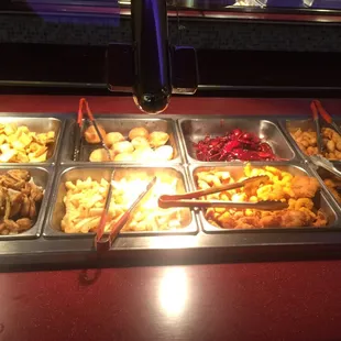 a variety of food items in a buffet