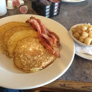 Pancakes, bacon, and home fries