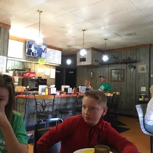 a boy and girl sitting at a table