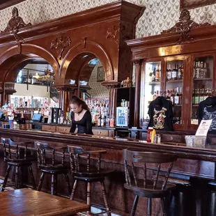 a woman behind the bar