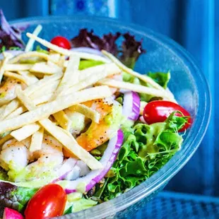 a salad in a plastic bowl