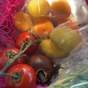 Mini apricots, mini mangoes, mangosteen, cocktail tomatoes, basil