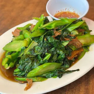 VILL SRAE-stir fry ong choy w/oyster sauce added crispy thinly sliced pork bellies