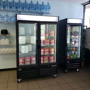 two refrigerators in a store
