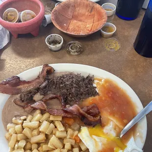 Huevos Rancheros with a side of barbacoa and Asada Tacos