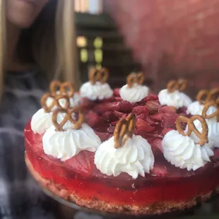 a woman holding a cake