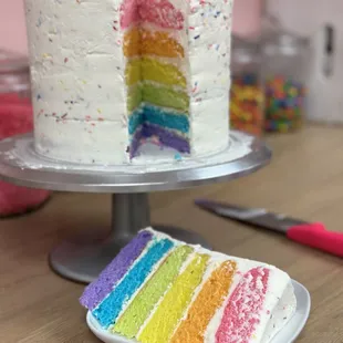 a slice of rainbow cake
