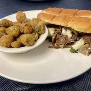 Philley Steak and cheese sandwich with a side of okra