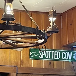 a sign for spotted cow