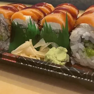 a plate of sushi rolls