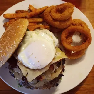 1/2 lb bacon onion cheese burger with fries and onion rings and optional egg