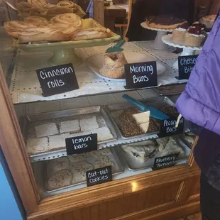 a display case filled with pastries