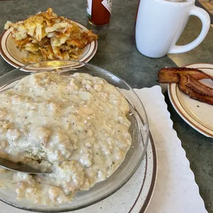 Biscuits and gravy, hash browns and bacon. Revisiting my photo, I&apos;m appalled at how it defines &quot;Blandness&quot;.