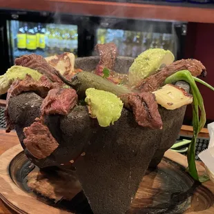 Grilled steak arrecheras molcajete.
