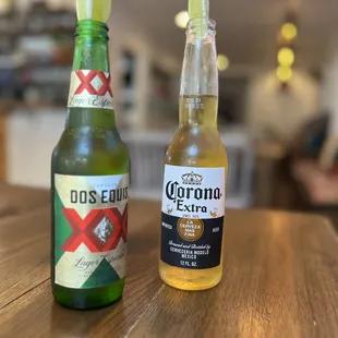 a bottle of corona extra and a bottle of corona extra