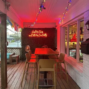 Adorable outdoor patio with neon sign