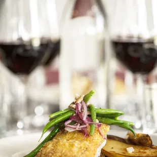  a plate of food and wine glasses