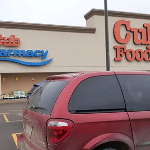 a car parked in front of a club pharmacy