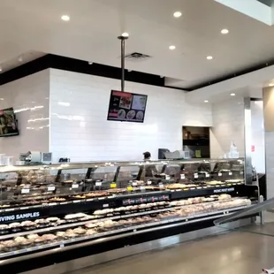 a deli counter with donuts