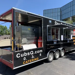 a catering truck parked in front of a building