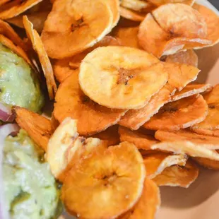 a plate of chips and a salad