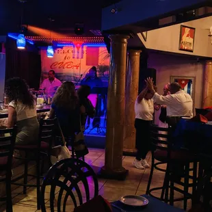 a group of people at the bar