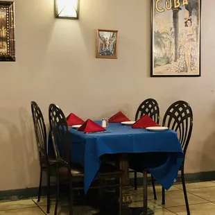 tables and chairs with blue tablecloths