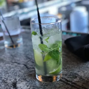 a glass of mojita