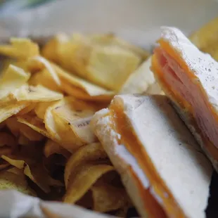 a closeup of a sandwich and chips