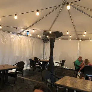 They have a great tent set up for outdoor dining- they even have a heater pre-positioned for the winter months!