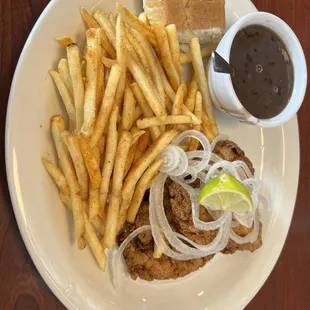 Pollo Empanizado, seasoned Boatload of Fries, Black Beans &amp; Rice
