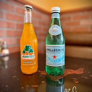 a bottle of san pellegrino and a bottle of san pellegrino