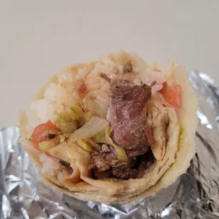 lechon burrito inside (pico de gallo, ghbbq and cienfuegos sauce, no beans)