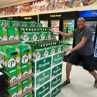 a man pushing a cart of beer
