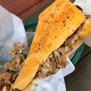 a sandwich with meat and cheese