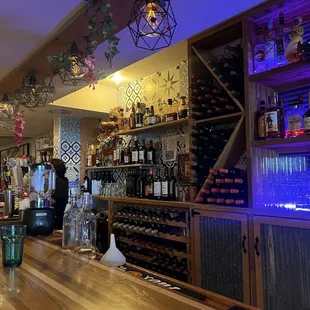 a bar with bottles of wine